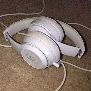 White Beats headphones with cord and case